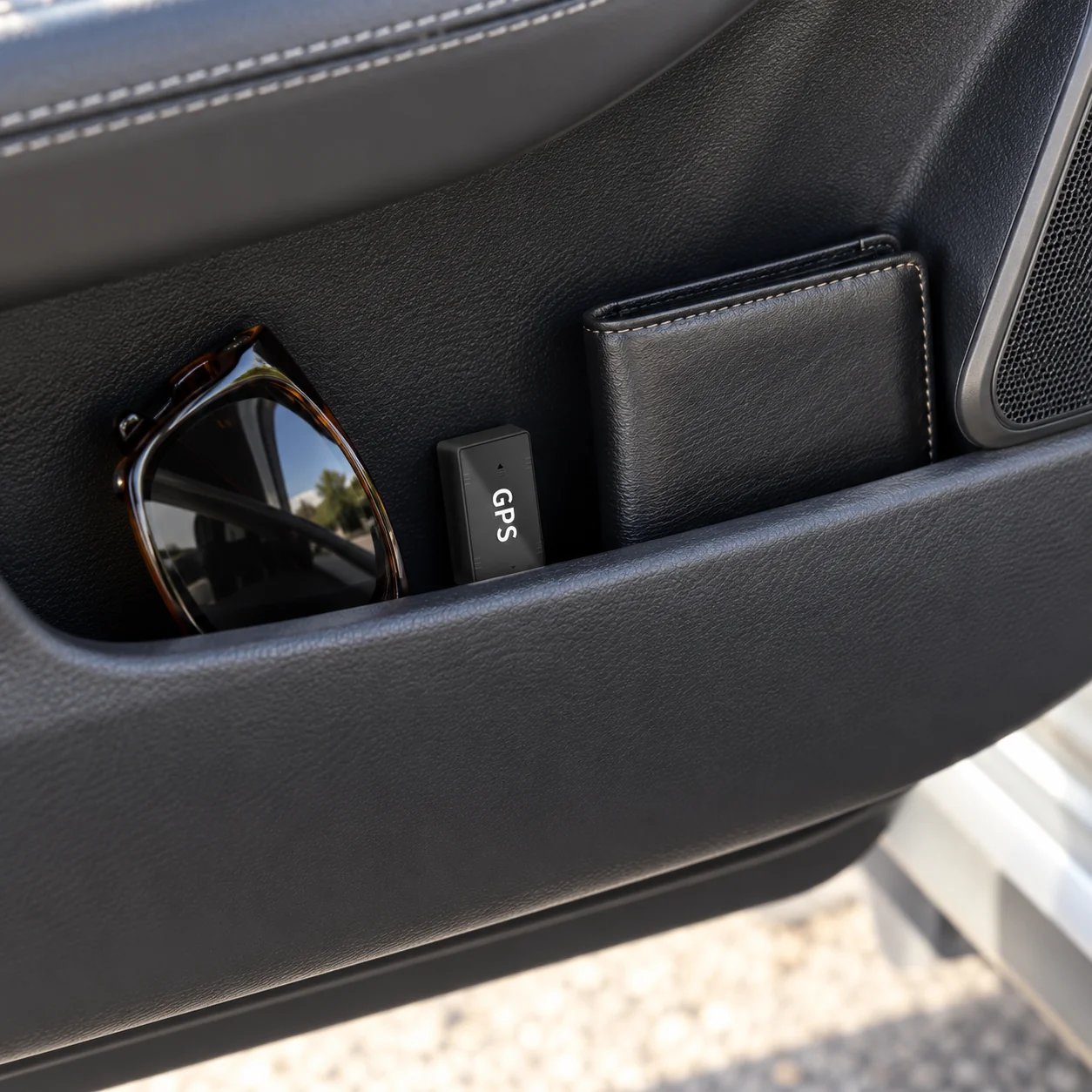 GPS tracker door storage area placement