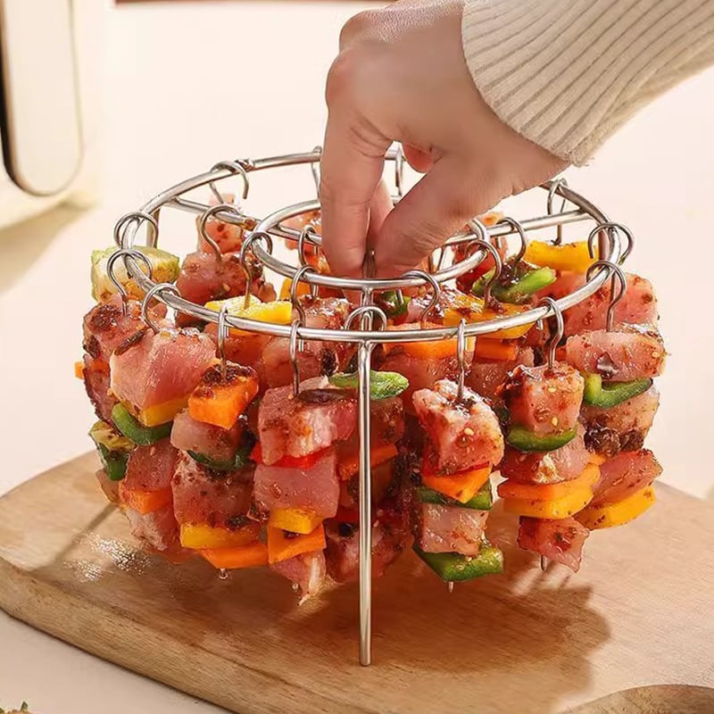 Delicious grilled meat and veggies cooked on the skewer stand