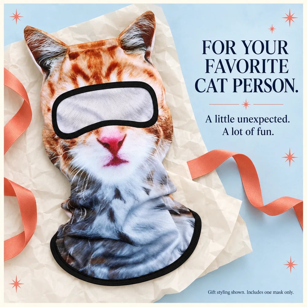 Orange cat balaclava styled with tissue and ribbon as a gift idea
