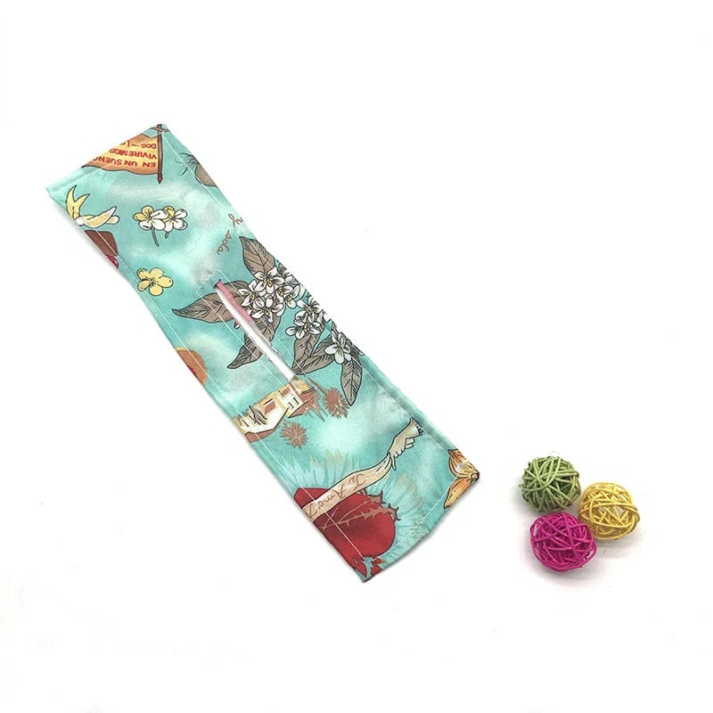 Green floral print hair accessory shown flat