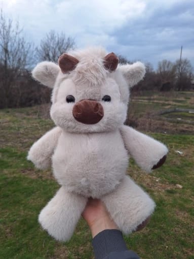Customer review photo of the Highland cow plush toy