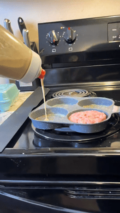Four-hole breakfast frying pan in use