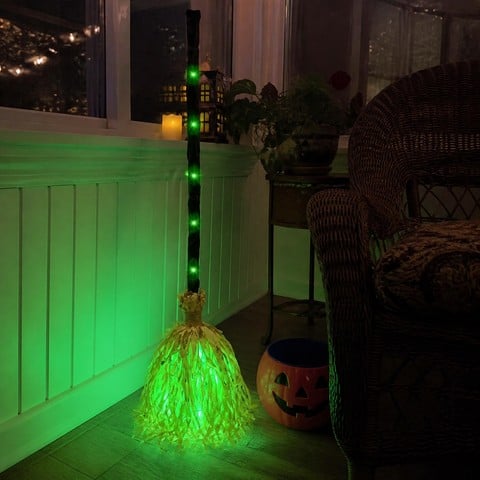 Glowing animated broom in a decorated indoor sunroom